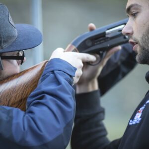 Break One Instructor showing man how to clay target shoot