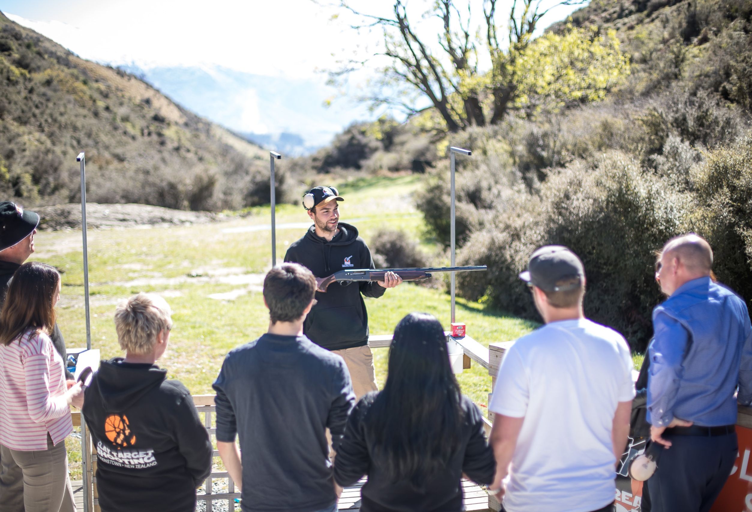 Instructor coaching a group during a clay target shooting session at Break One in Queenstown, providing safe, supportive guidance suitable for all abilities.