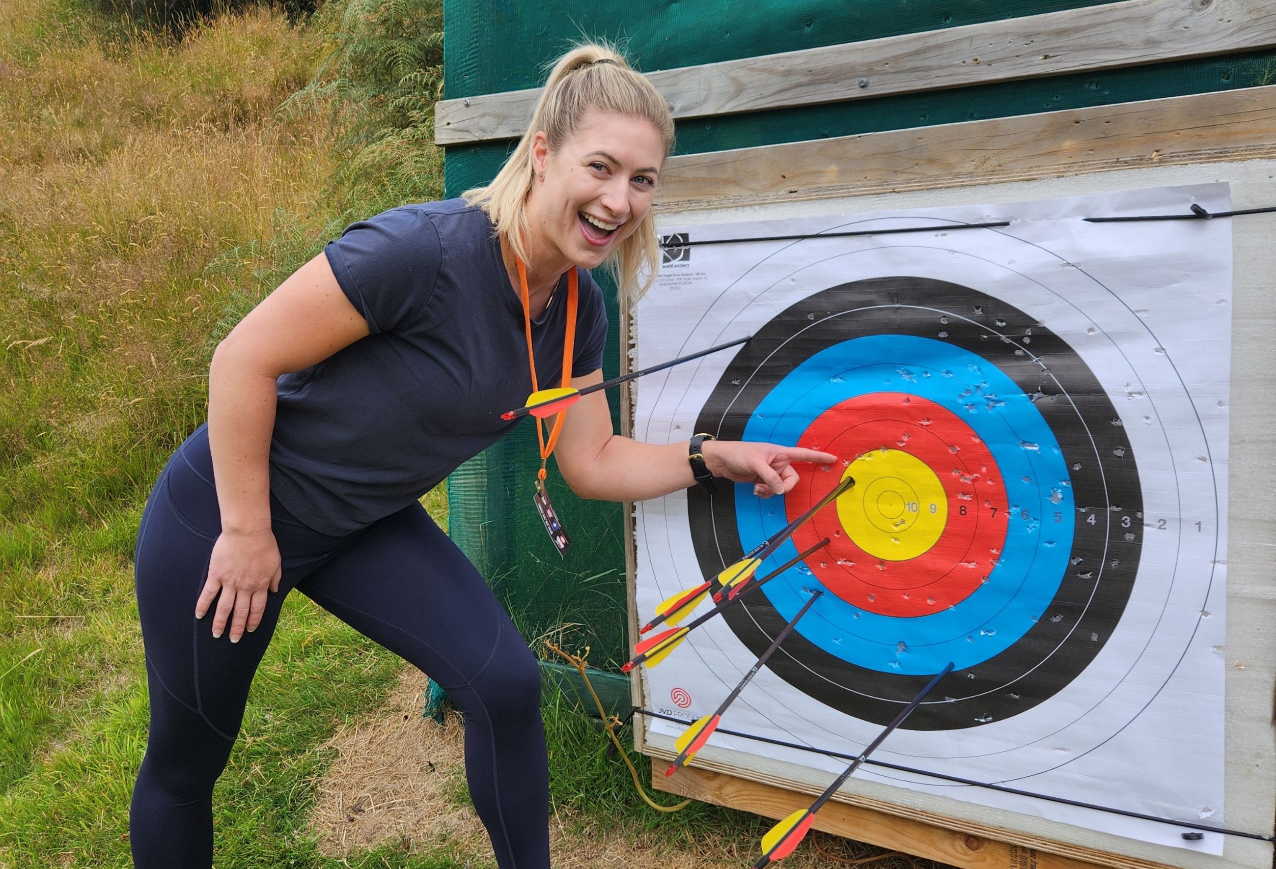 Guest hitting a bullseye at the archery range during The Full Monty experience near Queenstown.