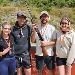 Group of friends enjoying The Full Monty experience with clay target shooting, archery, and knife throwing near Queenstown.